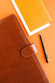 Modern workspace, productivity and corporate lifestyle concept - Luxury business brown brief-case on the office table desk, flatlay