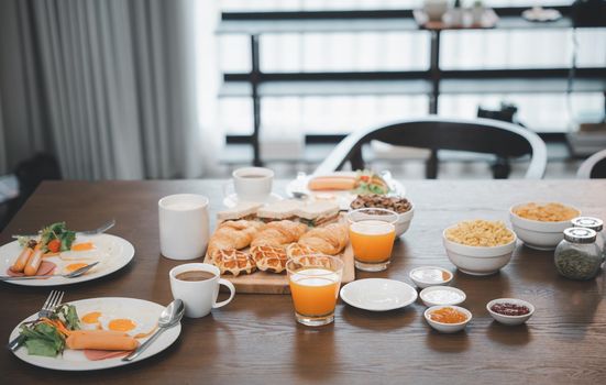 Fresh and bright continental breakfast healthy, Breakfast served food with beverage coffee, orange juice on table in the morning at home
