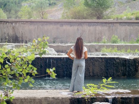 latino hispanic woman enjoying the river a cloudy day