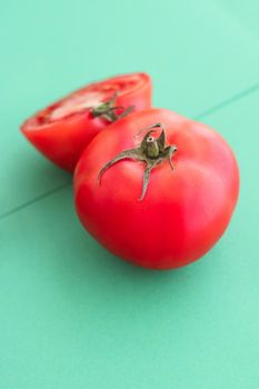 Plant based diet, vegetarian recipe and farm garden concept - Fresh ripe red tomatoes on green background, organic vegetable food