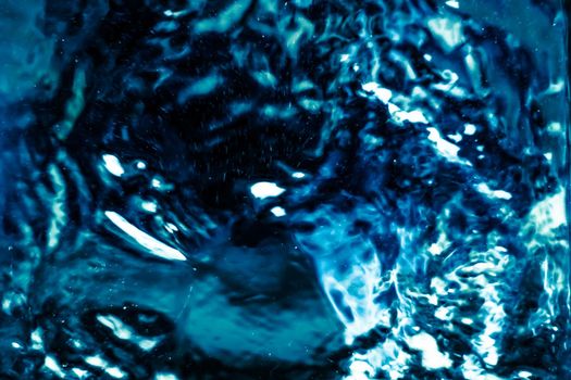 Abstract blue liquid surface as background - futuristic design and science concept. Deep blue waters