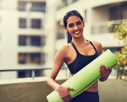 Yoga saves you time and money. a beautiful young woman practising yoga outdoors