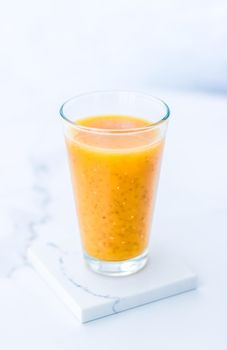 Healthy nutrition, organic drink and fasting cleanse concept - Glass of orange fruit smoothie juice with chia seeds for diet detox, perfect breakfast recipe