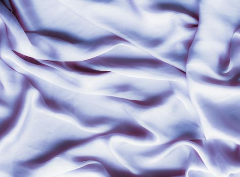 Elegant fabric texture, abstract backdrop and modern pastel colours concept - Purple soft silk waves, flatlay background