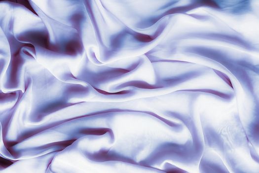 Elegant fabric texture, abstract backdrop and modern pastel colours concept - Purple soft silk waves, flatlay background