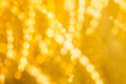 Golden Christmas lights, New Years Eve fireworks and abstract texture concept - Glamorous gold shiny glow and glitter, luxury holiday background