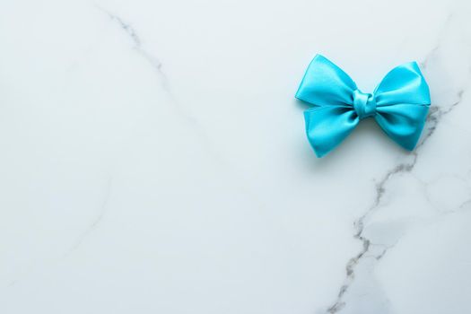 Holiday decor, feminine design and flatlay concept - Blue silk ribbon on marble, top view