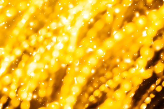 Golden Christmas lights, New Years Eve fireworks and abstract texture concept - Glamorous gold shiny glow and glitter, luxury holiday background