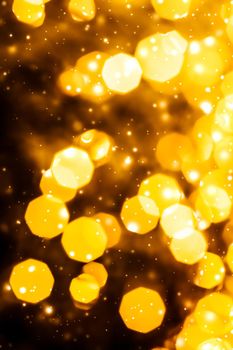 Golden Christmas lights, New Years Eve fireworks and abstract texture concept - Glamorous gold shiny glow and glitter, luxury holiday background