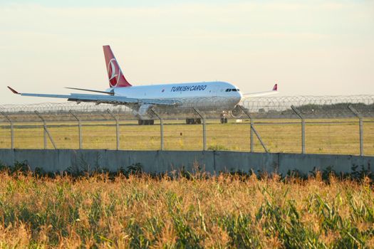 Turkish plane behind barbed wire. Ukraine Borispol 15.08.2020. The closed territory of the airport, behind a high fence, a Boeing aircraft. High quality photo