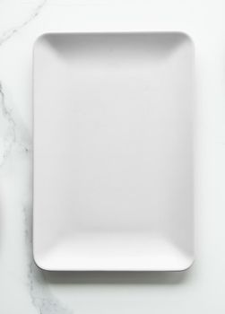 White empty plate on marble, flatlay - stylish tableware, romantic table decor and food menu concept. Serve the perfect dish