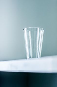 Glassware, washing and purity concept - Clean empty glass on marble table