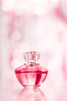 Perfume bottle on glamour background, floral feminine scent, fragrance and eau de parfum as luxury holiday gift, cosmetic and beauty brand present concept