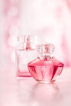 Perfume bottles on glamour background, floral feminine scent, fragrance and eau de parfum as luxury holiday gift, cosmetic and beauty brand present concept