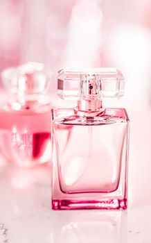 Perfume bottles on glamour background, floral feminine scent, fragrance and eau de parfum as luxury holiday gift, cosmetic and beauty brand present concept