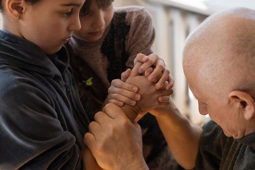 Family bonding. grandfather and child holding hands together, closeup view. Panorama.