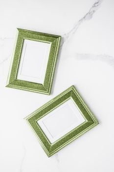 Modern feminine, artwork mock up, luxury design concept. Decorate with chic and style - Green photo frame on marble, flatlay