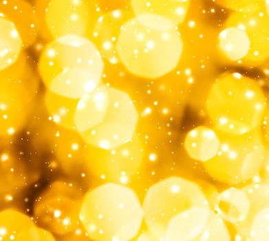 Golden Christmas lights, New Years Eve fireworks and abstract texture concept - Glamorous gold shiny glow and glitter, luxury holiday background