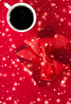 Hot drink, luxury festive menu and Valentines Day card concept - Winter holiday gift box, coffee cup and glowing snow on red flatlay background, Christmas time present surprise