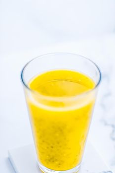 Healthy nutrition, organic drink and fasting cleanse concept - Glass of yellow fruit smoothie juice with chia seeds for diet detox, perfect breakfast recipe