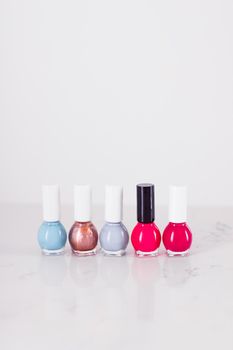 Beauty, make-up and cosmetics concept - Nail polish bottles, manicure and pedicure collection