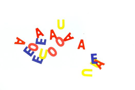 Many Multicolored vowels on white background