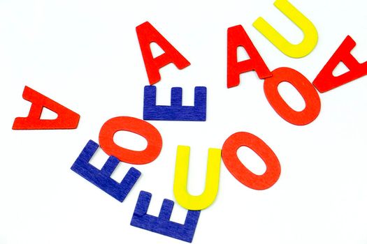 Many Multicolored vowels on white background