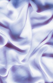 Elegant fabric texture, abstract backdrop and modern pastel colours concept - Purple soft silk waves, flatlay background