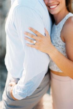 Woman leaning against man from behind. Cropped. High quality photo