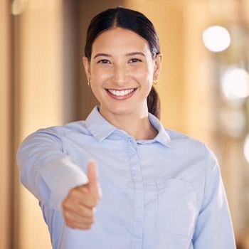 Thumbs up hand sign for success, employee motivation and excited business woman in an office at work. Portrait of a happy, smile and professional corporate manager, boss or worker at startup company.