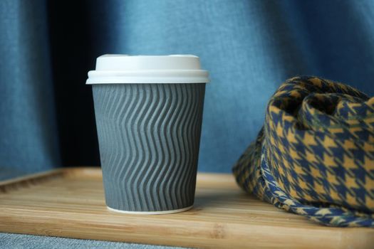 take away paper coffee cup o on cafe table ,