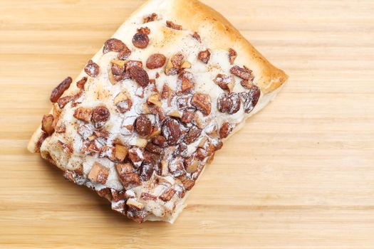 apple raisin bread on chopping board on table ,