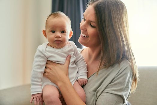 The unbreakable bond of creation. a young mother and her baby at home