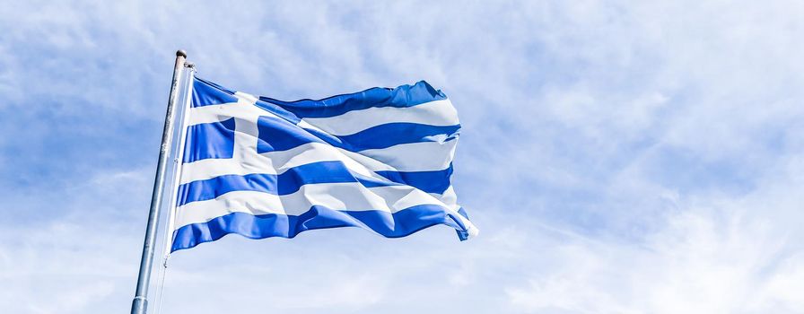 European political news, grexit and nation concept - Greek flag and cloudy sky in summer day, politics of Greece