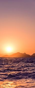 Nature, twilight and vintage beach holiday concept - Summer sunset at the Mediterranean sea coast, seascape and mountain view