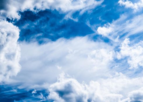 Nature backdrop, solar energy and spiritual concept - Blue sky background, white clouds and bright sunlight