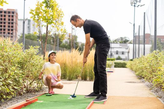 Family: Family Time Playing Mini-Golf In The Summer