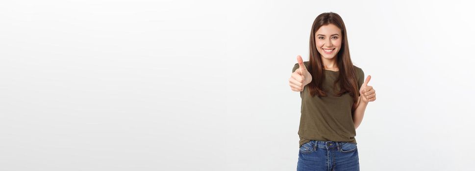 Closeup portrait of a beautiful young woman showing thumbs up sign. Isolate over white background