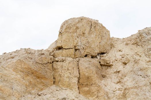 Ruins in a quarry. Dumps of clay and crushed stone in a quarry. Abandoned mine. Extraction of crushed stone by rotary excavators.