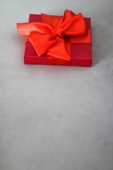 Wedding present, shop sale promotion and love celebration concept - Luxury holiday red gift box with silk ribbon and bow, christmas or valentines day decor