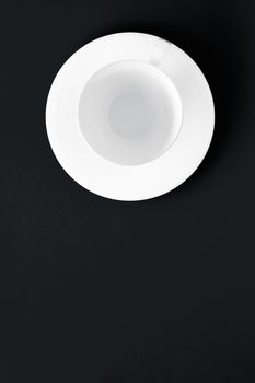 Kitchen, table decor and drinks menu concept - White tableware crockery set, empty cup on black flatlay background