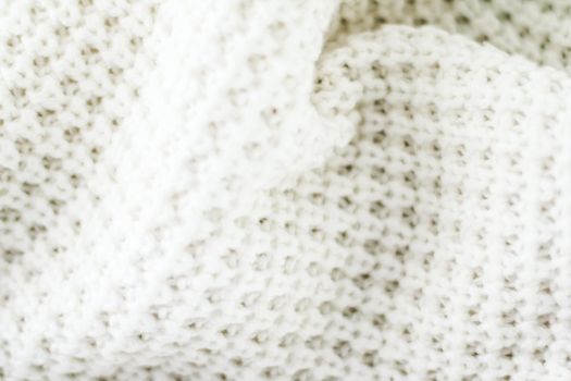 Knitwear, fabric textures and handmade items concept - Warm knitted clothes, soft and white