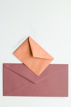 Postal service, newsletter and greeting card concept - Blank paper envelopes on marble flatlay background, holiday mail letter or post card message design