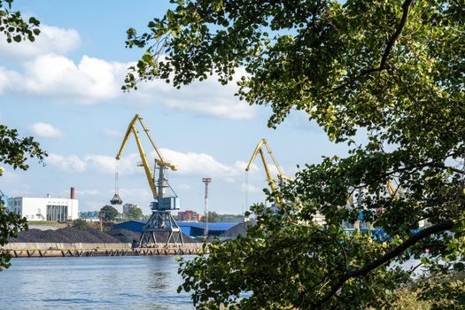 Vyborg, Leningrad region, Russia. - August 27, 2022. View of the commercial port with cargo cranes. Selective focus.