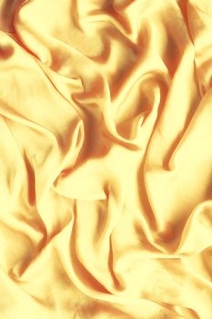 Luxury golden silk background texture - elegant fabric textures, abstract backgrounds and modern pastel colours concept