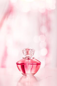 Perfume bottle on glamour background, floral feminine scent, fragrance and eau de parfum as luxury holiday gift, cosmetic and beauty brand present concept