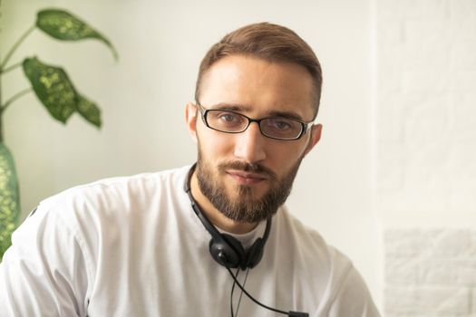 Headshot portrait of happy millennial man in casual clothes isolated on grey studio background posing, smiling young male in shirt look at camera with wide healthy teeth, demonstrated dental treatment.