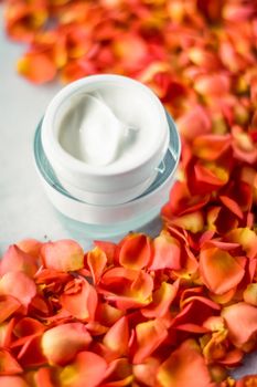 Facial treatment, anti aging skincare and spa concept - Beauty face moisturizing cream and flower petals on marble, luxury cosmetic product