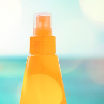 Suntan lotion outdoors - summer vacation, travel and body care concept. Protect your skin on the beach