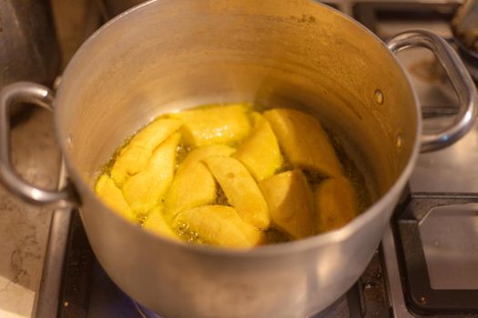 woman chef preparing african caribbean food with plantain plane tree fruit